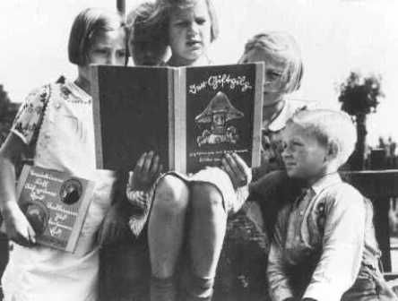 German children read an anti-Jewish propaganda book titled DER GIFTPILZ